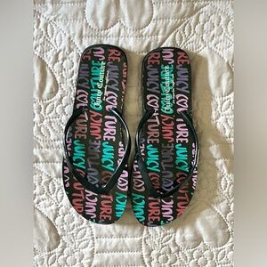Juicy couture flip flops with red, blue, pick, purple juicy lettering
